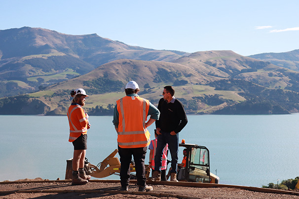 Group discussing Takapuneke construction progress